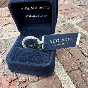 Sterling Silver Moissanite eternity ring, size 7.